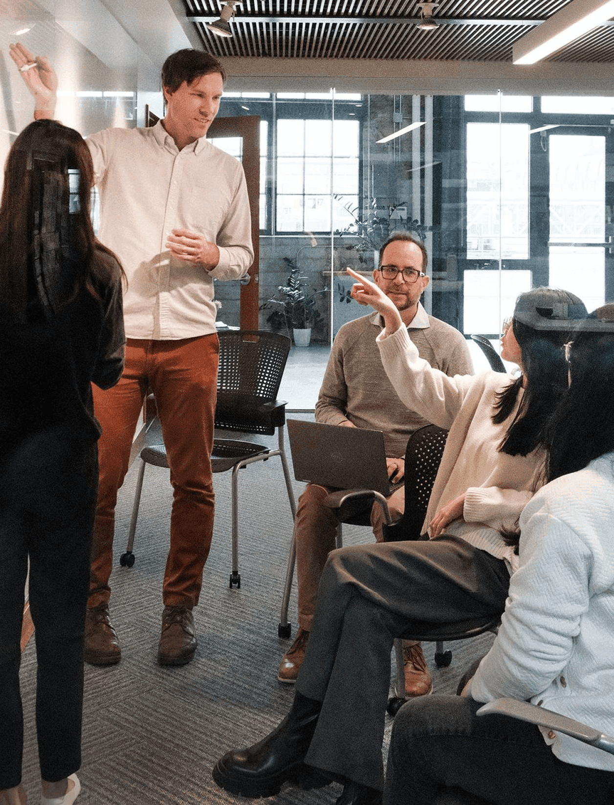 C.Scale team in a workshop discussion in an office